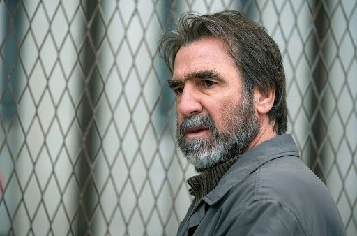 Screen Grab: ‘Inhuman Resources’ — Cantona hits dark places with his collar up
